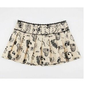 Current Mood Dolls Kill Studded Tattoo Print Pleated Mini Skirt Cream Black 1X